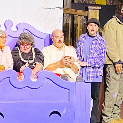 Having a family discussion, from left, are Grandpa George (Brandt Arganbright), Grandma Georgina (Julie Barnett), Grandma Josephine (Kat Tate), Grandpa Joe (Joshua Barnett), Charlie Bucket (Jocelyn Kos), Mr. Bucket (Landon Holcomb) and Mrs. Bucket (Ashley Many local actors in ‘Wonka’ production