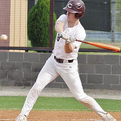 Clinton’s Cooper Sulley attacks the ball during the Reds’ home win Friday over the Fairview Jackets. CDN | Sam Goodwyn CHS Reds baseball ends losing streak