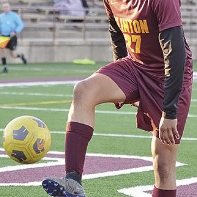 CDN | Sam Goodwyn No. 27 Jabez Gonzalez focuses on the ball during warmups Thursday prior to Clinton’s final regular season home game against Woodward. Senior looks to go out on top one last time