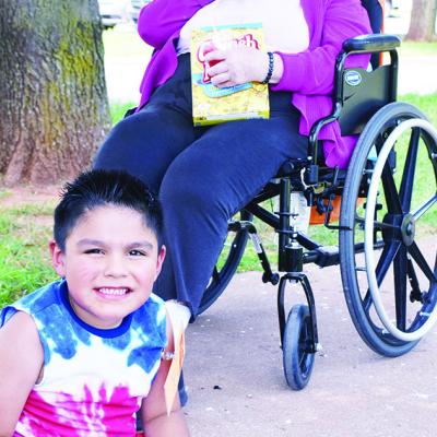 Mateo Gutierrez, front, and resident Betty Barnes enjoy snow cones on the front lawn at River Valley Skilled Nursing and Therapy at 2400 W. Modelle. CDN | Caleb Blanchard Hospice is big decision