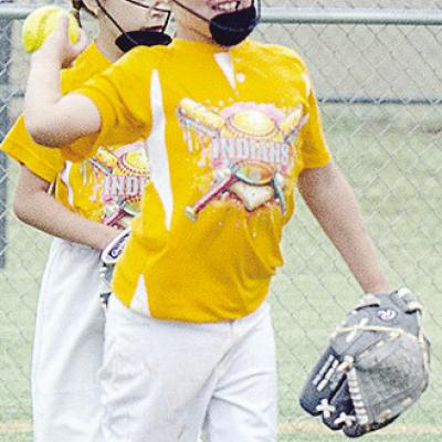 Arapaho-Butler’s Kimber Lacy throws the ball back in during the Lady Indians’ first-round game against Elk City during the OK Kids Softball State Tournament at Schumacher Fields at Acme Brick Park. CDN | Sam Goodwyn