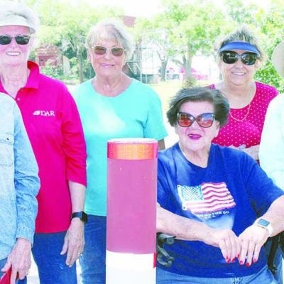 From left, Ellena Womack, Linda Stewart, Carol Ann Batterton, Robetha Fariss, Deborah Whinery, and Marci Grant, members of the Washita Chapter, National Society of the Daughters of the American Revolution stop for a photo. CDN | Elisha Rangel DAR members paint Clinton Veterans Center walkway