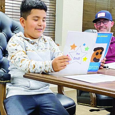 Young author steals show at school board meeting