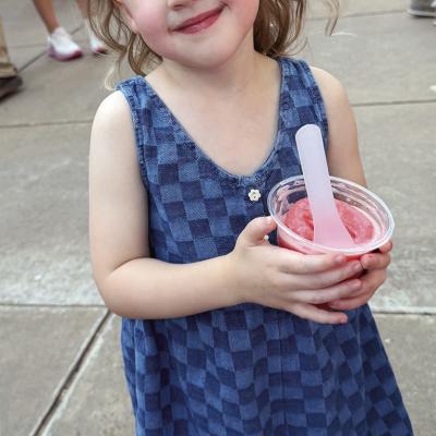 Evie Kliewer enjoys some cool Italian ice recently at the Clinton Farmers Market in Engleman Park. CDN | Courtesy photo