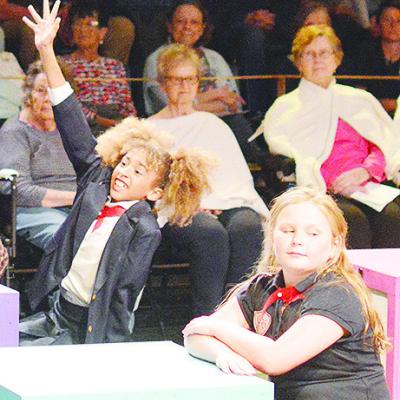 Huyler Christensen, left, and Ava Glasscock perform a classroom scene during the Southwest Playhouse production of “Matilda.” CDN | Micah Ashcraft