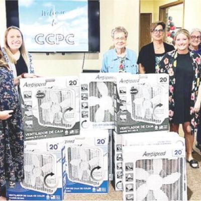 From left, Jennifer Vowell, Natalie Vowell, Chelsei Ronayne, Juanita Meacham, Canda Dupree, Alicia Curry, Carolyn Knisley, Susan Klein and Karen Murray donate fans that were purchased with money made from the Clinton Cumberland Presbyterian Church’s ann Turning salads into fans