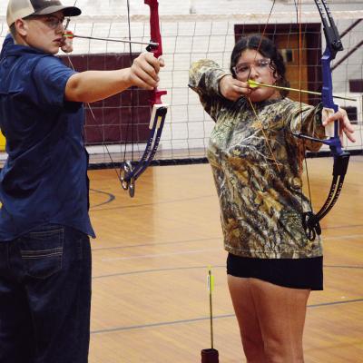 CDN | Micah Ashcraft Clinton High School archers Evan Hunter, left, and Alexis Vela take aim after tuning and breaking in their newest bows Tuesday afternoon ahead of their first practice. CDN | Micah Ashcraft Clinton High School archers Evan Hunter, left, and Alexis Vela take aim after tuning and breaking in their newest bows Tuesday afternoon ahead of their first practice.