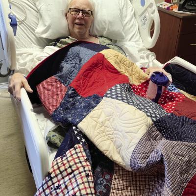 Fred Stehr was scheduled to be presented a Quilt of Valor earlier but was unable to attend the ceremony due to illness. He was presented the quilt recently at the hospital and is seen here beaming with pride. Stehr served in the U.S. Army. The quilt was p