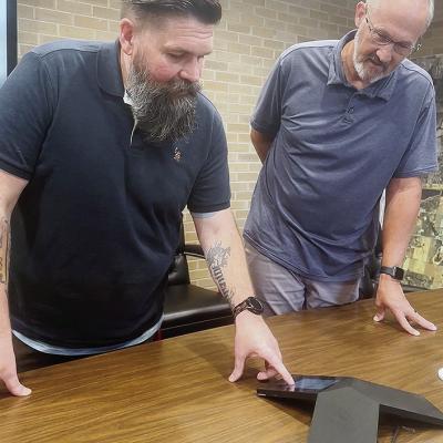 Brent Hester, left, and Gene McCullough examine an IT issue together while in the conference room at Clinton City Hall. CDN | Shiann Dawson Brent Hester, left, and Gene McCullough examine an IT issue together while in the conference room at Clinton City Hall. CDN | Shiann Dawson