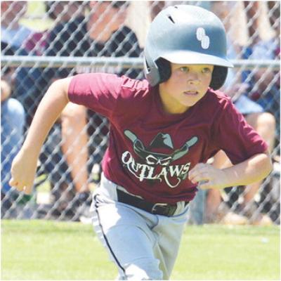 Grayson Rees runs to first base during the Poteau OK Outlaws game against the Altus Drillers during the OK Kids 8U Baseball State Tournament Wednesday at Schumacher Fields at Acme Brick Park. CDN | Sam Goodwyn OK Kids State Tournament opens play Wednesday in Clinton
