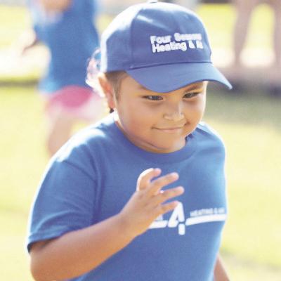 Ryanne Topaha bolts for first base during her T-Ball game this past spring. CDN | Sam Goodwyn Ryanne Topaha