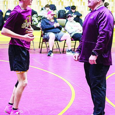 CDN | Sam Goodwyn Coach Austin Long, right, talks with Carsen Smith prior to the Hub City Tournament held at the Tornado Dome.