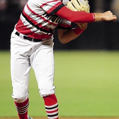 Caden Powell hurls the ball for the out during a game for the Fayetteville Woodpeckers