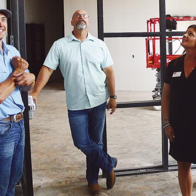 From left, Project Manager Justin Becker gives new Superintendent Nathan Meget and Clinton Board of Education President Kim Meacham a tour of the new Clinton Middle School building after Monday’s board meeting. CDN | Micah Ashcraft