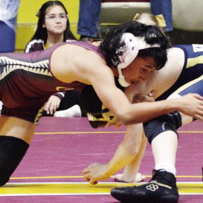 Azreal Fierros works to secure a takedown against his Kingfisher opponent in a CMS wrestling dual. CDN | Andrew Cunningham Azreal Fierros