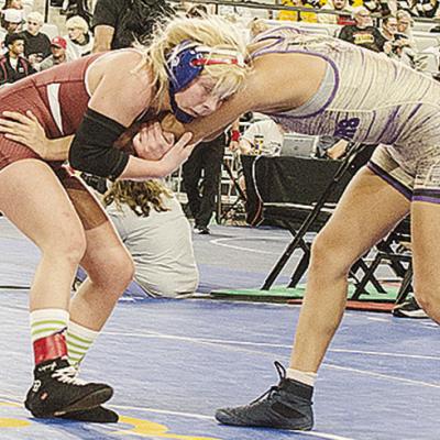 Clinton’s Baylor Moore, left, grapples with her opponent during the consolation semifinals of the Class 5A girls’ wrestling tournament Saturday morning at OG&amp;E Coliseum in Oklahoma City. CDN | Sam Goodwyn