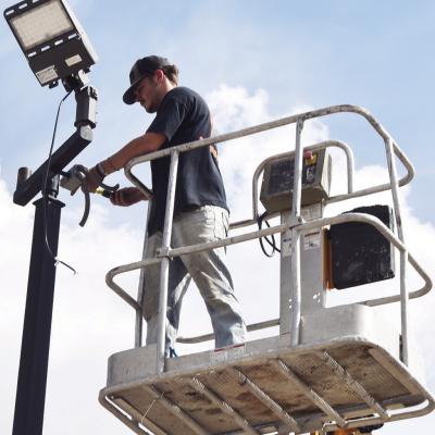 CDN | Emily Stephens Jeremiah Thompson replaces an outdoor light near the parking lot at Cornerstone Church, located at 1900 Lexington Ave. Brightening the space