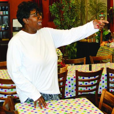Pastor Wilma Jackson shows the dining area for the new soup kitchen at H.O.S.T. Ministries Church in Clinton. CDN | Christian Jacobsen