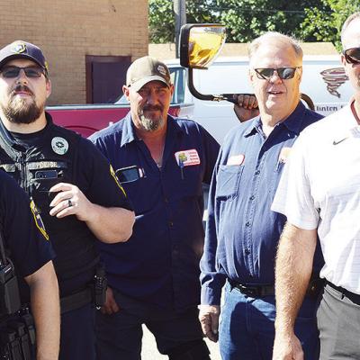 From left, Clinton Police Department School Resource Officers Andrew Wilson and Dillon Whitten, Nate Burnett, Rick Challis, and Transportation Director Jeff King get ready to roll out after a meeting at the Clinton Public Schools Bus Barn. CDN | Micah Ash From left, Clinton Police Department School Resource Officers Andrew Wilson and Dillon Whitten, Nate Burnett, Rick Challis, and Transportation Director Jeff King get ready to roll out after a meeting at the Clinton Public Schools Bus Barn. CDN | Micah Ash