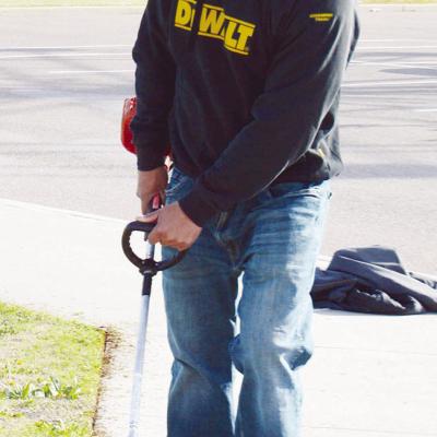 Robert Plaza with the City of Clinton Streets Department does some edging near the soccer fields at Acme Brick Park. CDN | Michael Maresh