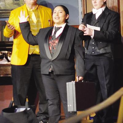 Mr. Boddy (Diana Torres) talks about blackmailing the guests during Southwest Playhouse’s production of “Clue.” In disbelief are Colonel Mustard (John Williams), left, and Wadsworth (Whitten Eustace). CDN | Staff Photo