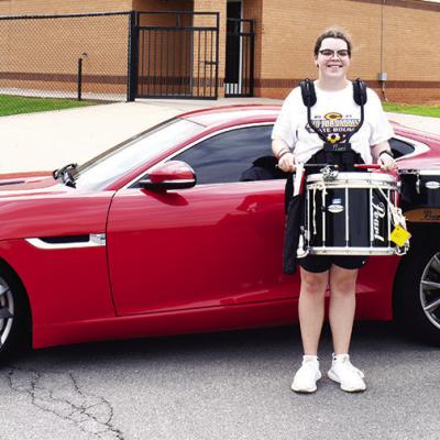 CDN | Nydia Campbell Drums, cars bond for band fundraiser