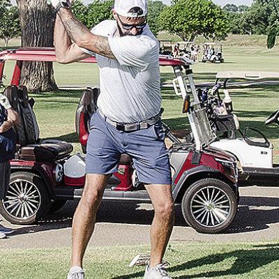 Roy Stucker focuses on the ball as he prepares to hit it Saturday during the Continue the Tradition Tournament at Riverside Golf Course. CDN | Sam Goodwyn