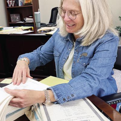 Jill Weedon goes over documents in her office. CDN | Shiann Dawson Jill Weedon goes over documents in her office. CDN | Shiann Dawson