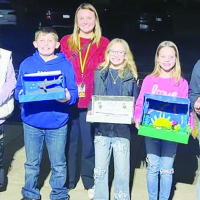 Fourth-grade Southwest Elementary teacher Randi Wallace had a group of her students present their projects to the Clinton School Board recently. From left, are Zianna Almquist, Braxtyn Taylor, Wallace, Ellee Hall, Stella Shackleford and Cadence Aston. CDN