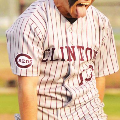Clinton senior pitcher Manning McAtee celebrates after posting another zero on the scoreboard in the Reds’ win over Elk City. CDN | Collin Wieder