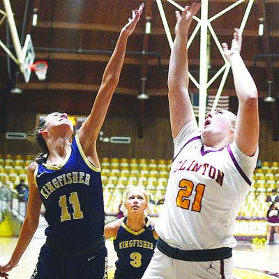 Clinton’s Rhylee Rodebush shoots the ball over a Kingfisher defender Saturday during the district round of the Class 4A Basketball Tournament at the Tornado Dome. CDN | Sam Goodwyn