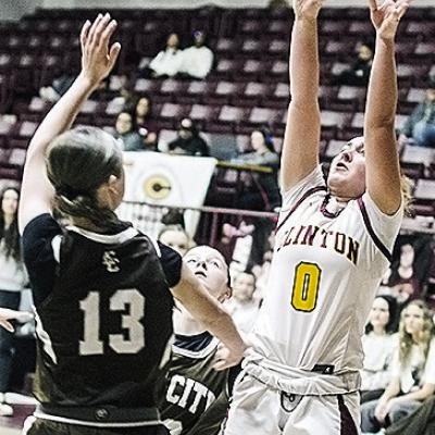 Clinton’s Laney Anderson, right, shoots over the Elk City defender Saturday during the Lady Reds’ home game. CDN | Sam Goodwyn
