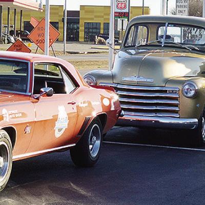 America’s Automotive Trust Communications Director Jake Welk steps out of just one of the several classic vehicles in a caravan stopping at the Oklahoma Route 66 Museum while traveling the entire length of Route 66 ahead of the car’s display at the De