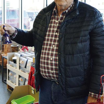 Warren Wilson rings the bell and greets people at Homeland to collect donations for Clinton’s Mission House. The bell ringing season is coming to a close with the last day for people to donate to the fundraiser being Saturday. CDN | Emily Stephens Greeting with joy