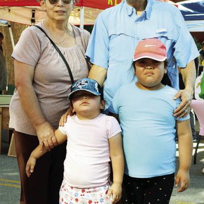 Maisyn Arvizo and Preslee Carrizales, front, with Juanita Carrizales and Jaime Carrizales visit the Farmer’s Market at Engleman Park. CDN | Christian Jacobsen