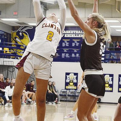 No. 2 Ella Redshin goes up for a layup attempt over the Elk City defender during Clinton’s Class 4A Regional Tournament basketball game against the Elkettes Friday in Kingfisher. CDN | Sam Goodwyn