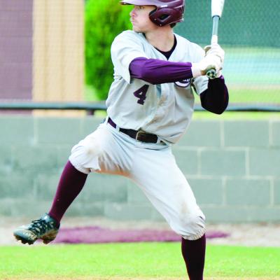 Grady Gaunt steps into his swing during a playoff game against Plainview at home. CDN | Sam Goodwyn Reds end season in pair of losses at regionals