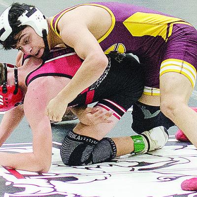 Clinton’s Matthew Bermea, top, holds his opponent to the mat during the first day of the Max Dippel Memorial Wrestling Tournament Friday in Weatherford. CDN | Sam Goodwyn