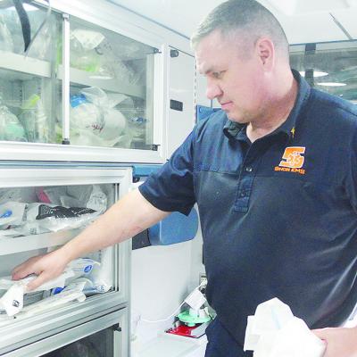 Sinor EMS Technician Jerry Rhein stocks the back of his ambulance with various sets of new medical equipment. CDN | Micah Ashcraft Sinor EMS Technician Jerry Rhein stocks the back of his ambulance with various sets of new medical equipment. CDN | Micah Ashcraft
