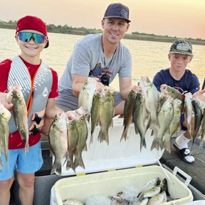 James Boone, center, recently took Trelyn Didier, left, and Kyler Didier for an eventful fishing trip. They were featured in the Oklahoma Department of Wildlife Conservation’s newsletter. CDN | Courtesy photo