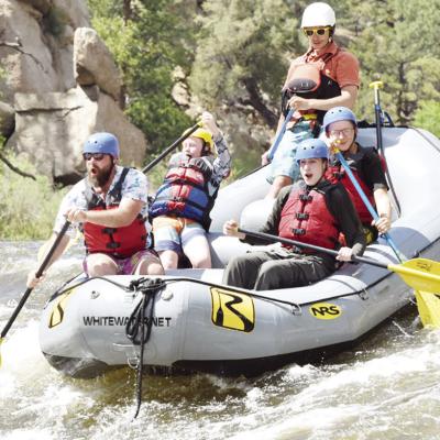 During the Boy Scouts of America Troop 361 and Cub Scout Pack 361 trip to Colorado over the summer, the group competed in white water rafting. From left are Assistant Scoutmaster Floyd Sanders, Conner Kreizenbeck, an unidentified Colorado White Water Raft Scouts to host new peers