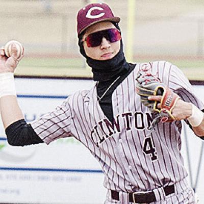 Clinton’s Declan Brown throws the ball back to the pitcher in the Reds’ game against Kingfisher. CDN | Sam Goodwyn
