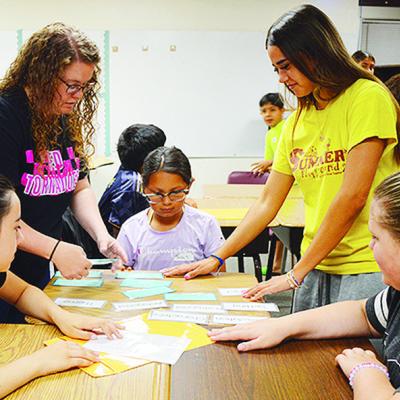 From left, fifth-grader Victoria Weil, Dakota Jackson, fifth-grader Tinsley Barron, Adrean Rodriquez, and fifth-grader Ashlynn Gibson, work on a story writing activity Tuesday morning at Washington Elementary School. CDN | Micah Ashcraft From left, fifth-grader Victoria Weil, Dakota Jackson, fifth-grader Tinsley Barron, Adrean Rodriquez, and fifth-grader Ashlynn Gibson, work on a story writing activity Tuesday morning at Washington Elementary School. CDN | Micah Ashcraft