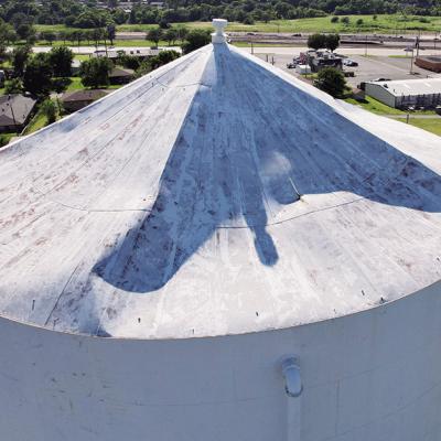 Storms leave water tower roof in ruin