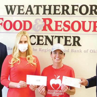 From left are donors Andy Carruth and Chaille Walraven, Graft & Walraven; Lori Flansburg, Weatherford Food & Resource Center executive director; and Matt Jackson, with Bank of the West. $50,000 donation will provide 160,000 meals in area