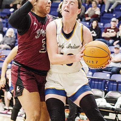 No. 10 Kelsey Garibay drives through a Pioneer-Pleasant Vale defender, as she heads toward the basket in A-B’s win over the Lady Mustangs Saturday to clinch the district championship. CDN | Sam Goodwyn