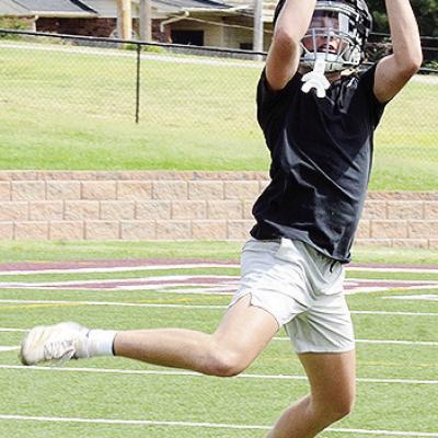Dyson Moss jumps to snag the ball during a drill in practice at the Tornado Bowl. CDN | Sam Goodwyn