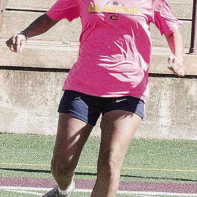 Clinton’s Gianna Burns focuses on kicking the ball during a practice in the Tornado Bowl. CDN | Sam Goodwyn