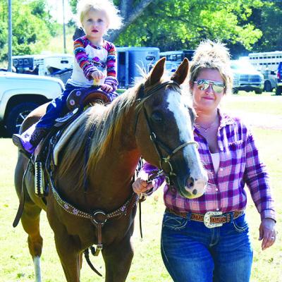 Olivia Shannon rides her horse Sugar while led by her mom Chelsea Shannon at the Clinton Round-Up Arena for the club’s Fall Play Days. CDN | Caleb Blanchard A family sport