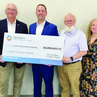 Getting everyone together to gather for a photo to commemorate the Financial Assistance Program loan from the Oklahoma Water Resources Board was the objective at the end of Friday’s Legislative Luncheon at the Frisco Center. From left are Mayor David Be